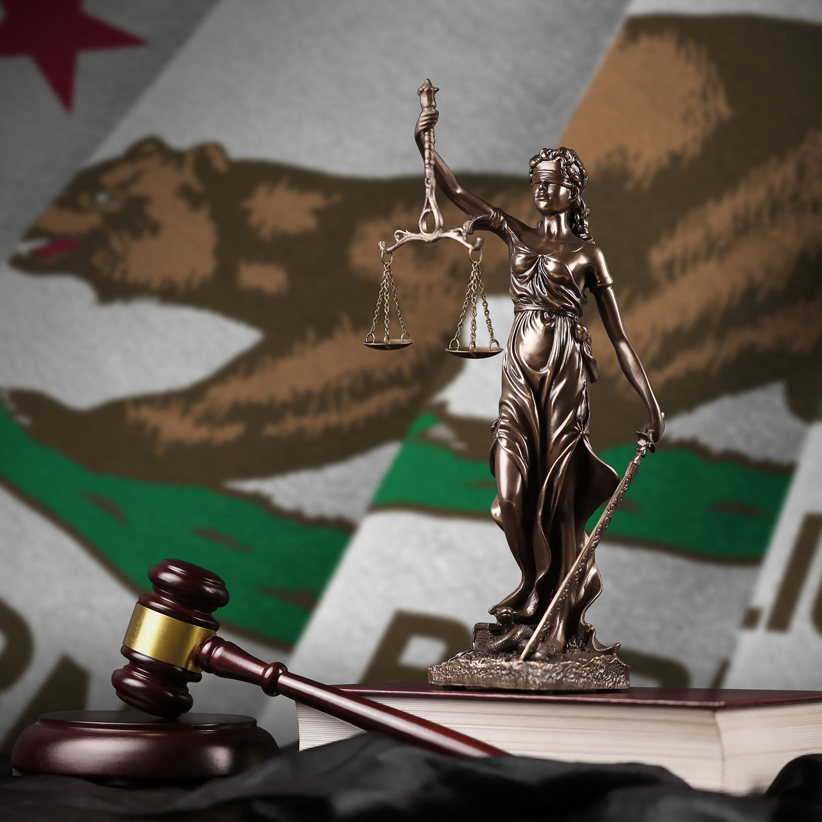 The statue of Justice, symbol of the law, as she holds aloft her balance scale, is blindfolded.